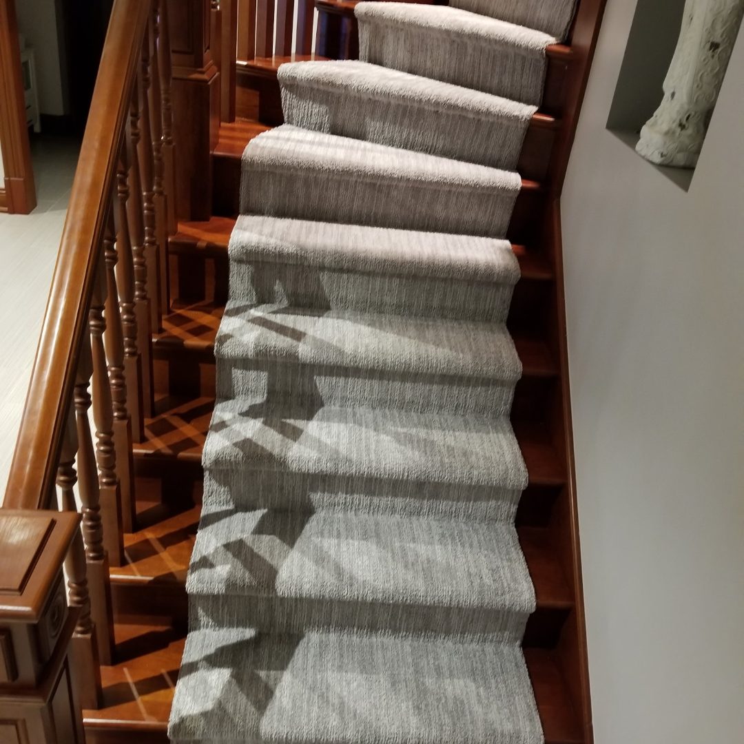 Grey berber carpet installation