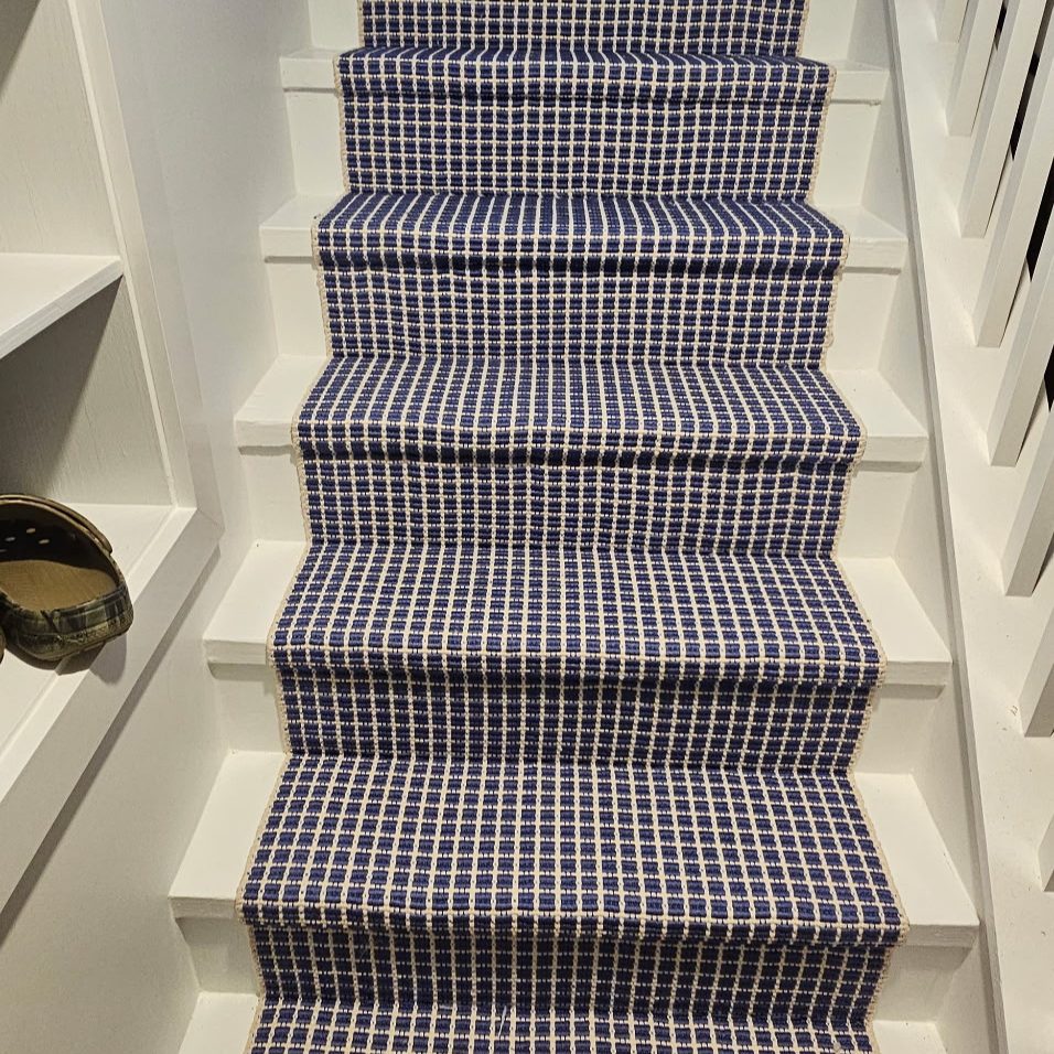 Black plaid stair runner installation in Grayslake